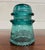 This is a gorgeous aqua or teal vintage glass Hemingray insulator. “Hemingray-16.” Made in the U.S.A. Has some chips, as...