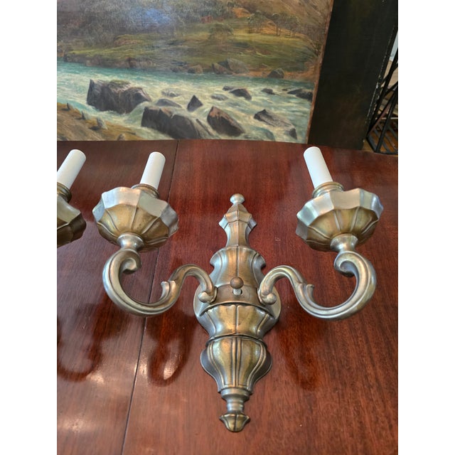 A fine pair of classical mid century era sconces. Having solid quality typical of good vintage 1940s to 1960s designer...