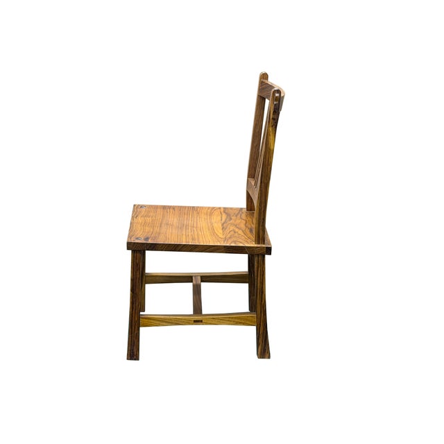Bring timeless Asian elegance and organic drama into your space with this stunning Ming-style hardwood side chair. The...
