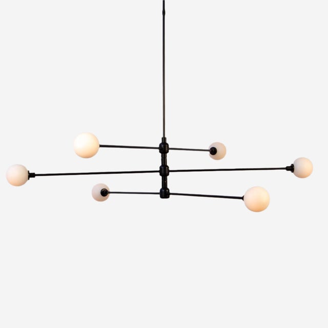 Three tiers of soft globes and shifting angles. Its black steel arms rotate independently, giving you control over the...