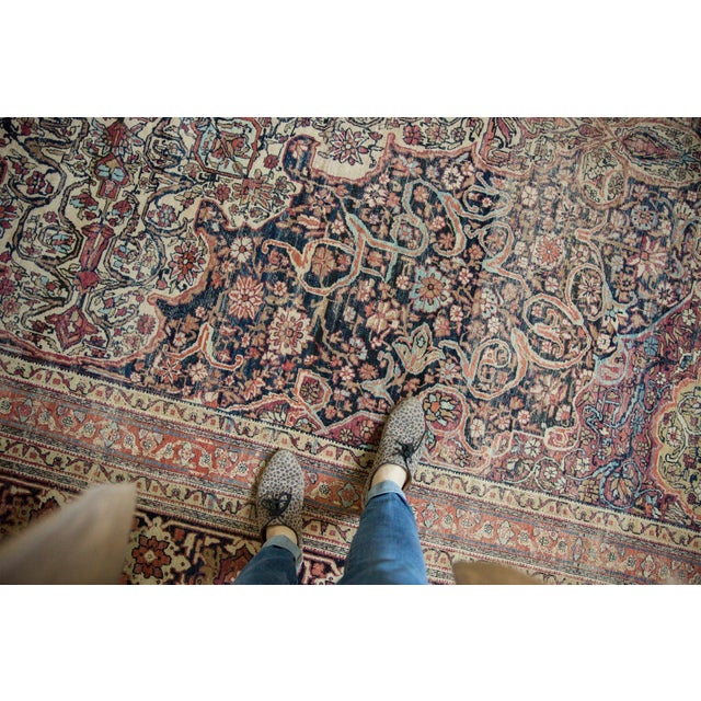 :: Fantastic example of a Kermanshah carpet with tremendous oversized medallion with scalloped contour, filled with...