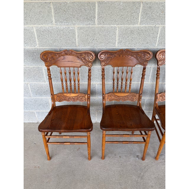 Description: Tom Seely Oak Press Back Dining Chairs - Set of 4. In Good Vintage Furniture Condition, Normal Age Wear, such...
