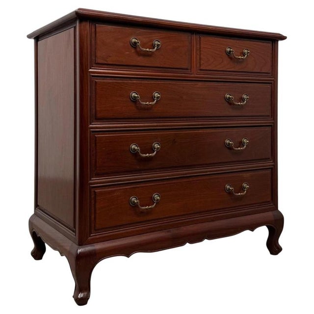 A handsome and elegant 20th-century mahogany chest of drawers, combining generous storage capacity with graceful...