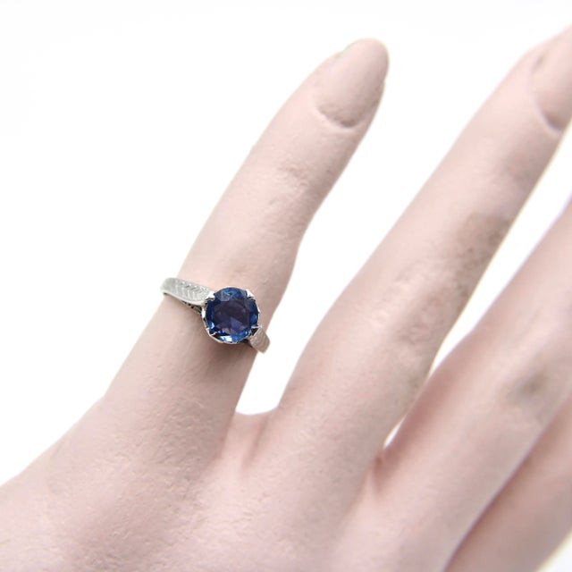 This is part of Chairish’s Fine Jewelry assortment. This 14k white gold ring features a natural sapphire in an Art Deco...