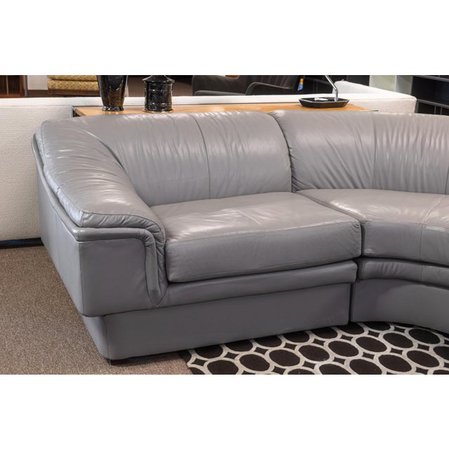 A 4pc vintage sectional sofa. This sofa set features a simple postmodern design, timeless and chic, featuring a dove gray...