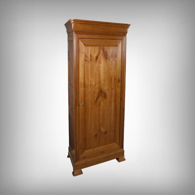 This elegant cherrywood armoire, crafted in the late 19th century, exquisitely embodies the Louis-Philippe style. Its...