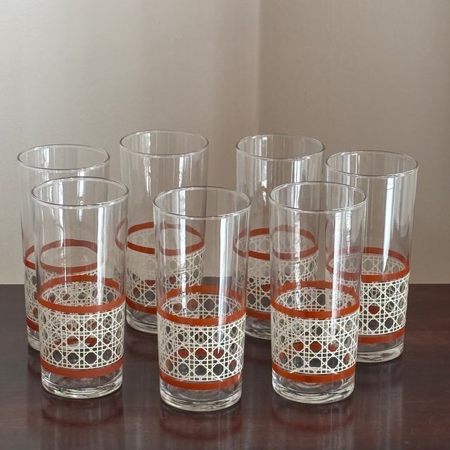 Offering a beautiful set of seven large-size tumblers by Libbey. This lovely mid-20th-century glassware set features a...