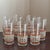 Offering a beautiful set of seven large-size tumblers by Libbey. This lovely mid-20th-century glassware set features a...