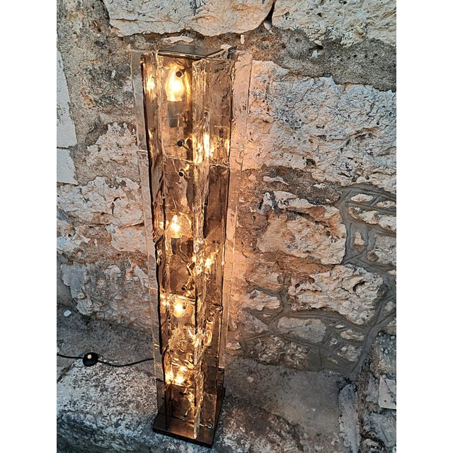 Floor Lamp LT379 by Carlo Nason for Mazzega. A rare textured glass floor lamp consisting of interlocking smoky gray and...