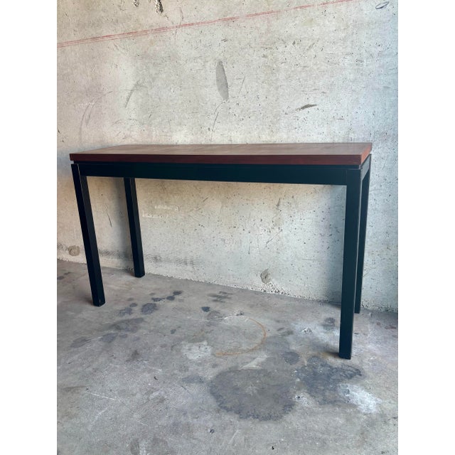 A refined mid-century console table by J.B. Van Sciver Co., dating to the 1950s. The table features a clean, architectural...