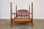 Impressive American classical spindle bed crafted from fruitwood. The bed features exaggerated tall bobbin or spool turned...