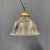 Beautiful medium-sized pressed glass Holophane pendant lamp from France, 1930s. Fitted with a brass fixture with an E27...