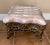 Very nice, sturdy, Victorian style footstool, with a cast iron base and rose pink Silk upholstered, top. Cast iron base is...