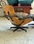 Vintage Herman Miller Charles Eames lounge chair and ottoman, featuring smooth black leather and molded walnut shell...
