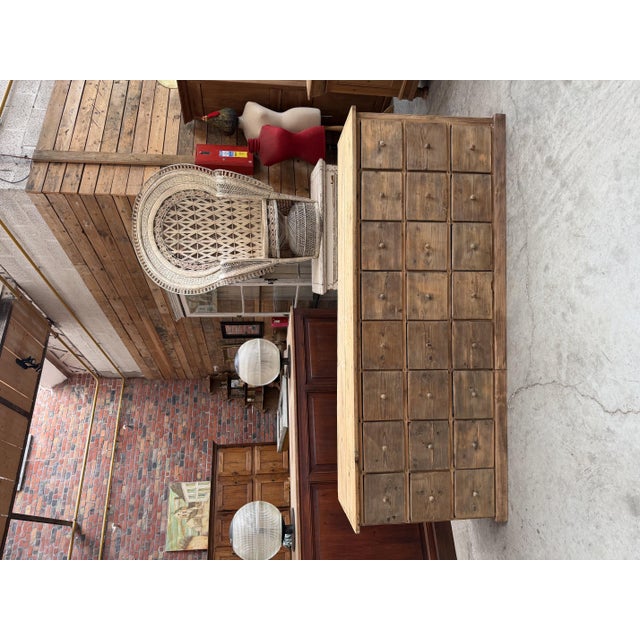 This antique pine cabinet was fully restored. It features 24 functional drawers with wooden handles. Drawer dimensions:...