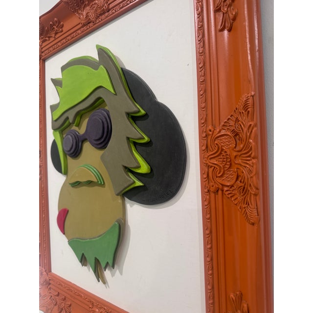 Mono, an original layered porcelain relief by Cuban artist Manuel Pérez, signed on the back, in a frame painted by the...