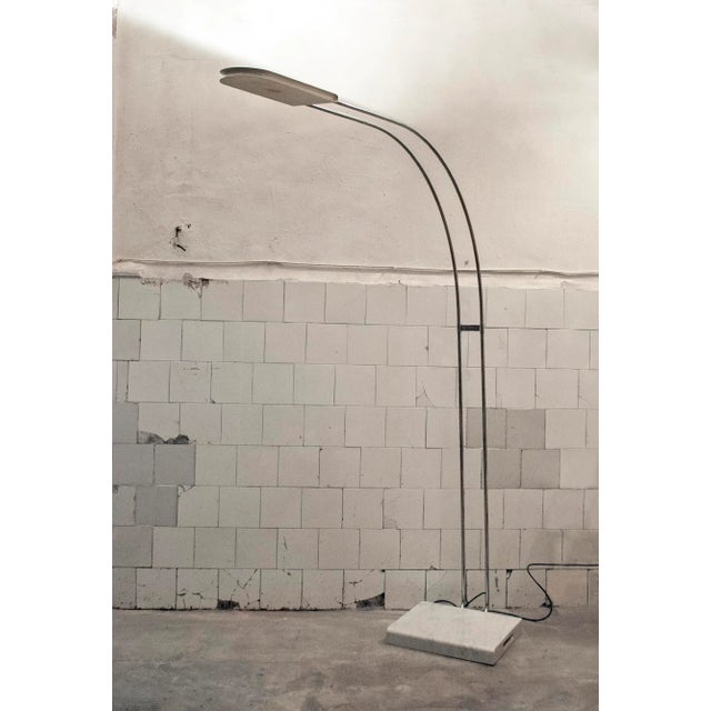 Floor lamp with chromed metal frame and lacquered metal, marble base. Model: Gesture Designer: Bruno Gecchelin Sirrah...