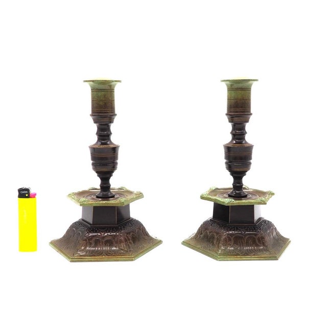 A pair of classic candlesticks from Ystad Brons, one of Sweden's most well-known metal art companies during the 20th...