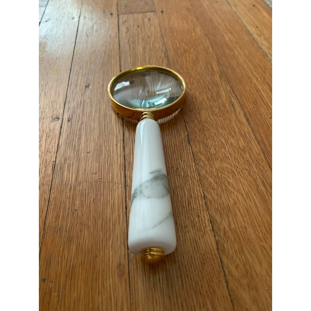 A beautiful marble and brass magnifying glass for your desk. Glass is approx. a 2 1/2 times magnifyer. Sourced by The...