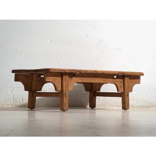 Antique low table in pine wood, traditional chinese furniture originating from northern china and dated circa 1930....