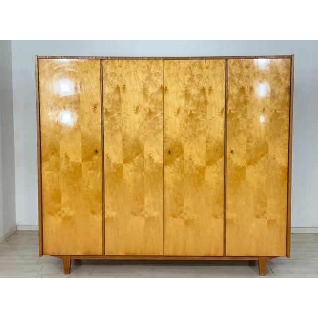 Mid-century wardrobe from the 1960s with beautiful birch veneer. Clean lines, warm wood tones, and generous storage space...