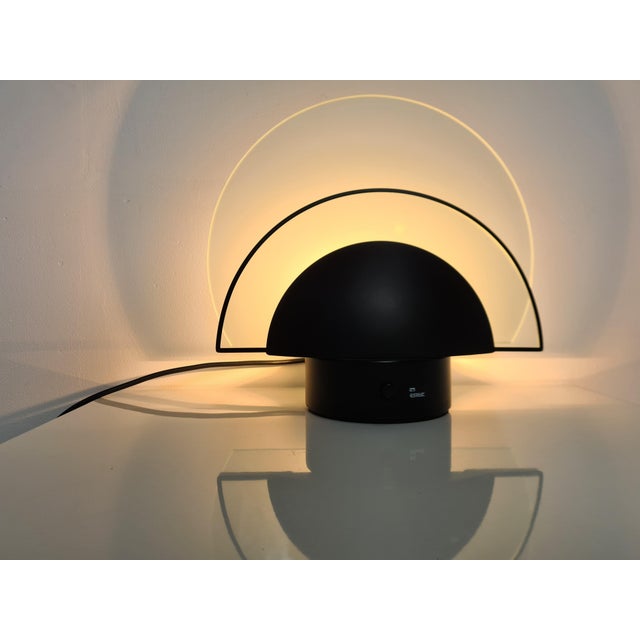Great piece by Estiluz from Barcelona. This Postmodern dimmable black table lamp was made around 1990 and was fitted for...