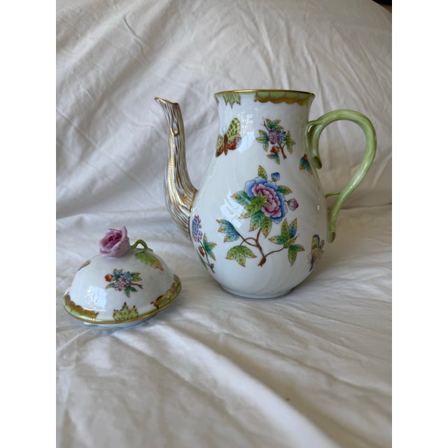 The coffee pot features the classic "Queen Victoria" pattern characterized by colorful peonies and butterflies on white...
