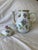 The coffee pot features the classic "Queen Victoria" pattern characterized by colorful peonies and butterflies on white...