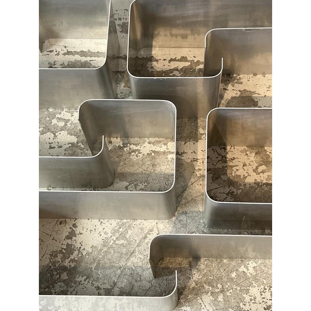 This set of zig-zag stainless steel shelves was designed by Joëlle Ferlande in collaboration with François Monnet in the...