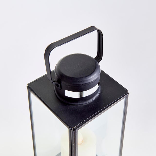 Finished in a warm antique black, this lantern has classic lines and a simple design. With vents in base and top, and...