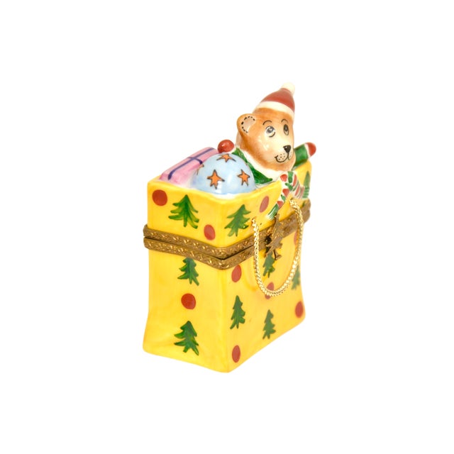 Vintage Limoges of France accent trinket box retired design of a colorful holiday bag stuffed full of gifts, ornaments and...