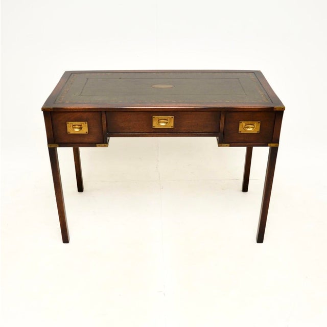 A wonderful antique military campaign desk / writing table. This was made in England, it dates from around the 1930’s. It...
