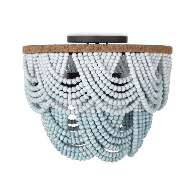 Now styled as a flush mount, the Ombre Wood Bead fixture is stunning, even on a smaller scale. The wooden beads drape...