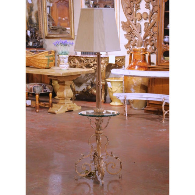 Place this elegant antique floor lamp and side table combination in a living room, salon, or reading corner for both...
