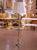 Place this elegant antique floor lamp and side table combination in a living room, salon, or reading corner for both...