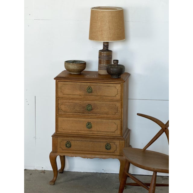 Danish chest of drawers in quartersawn oak, designed by Henning Kjærnulf, 1960s. The top shows strong ray fleck across its...