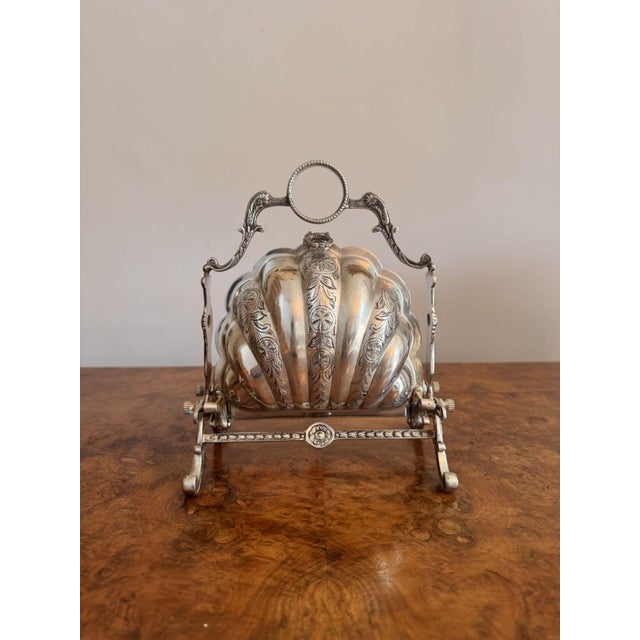 Antique Silver Plated Folding Shell Biscuit Box having an ornately decorated shell case with original ornate frame and...