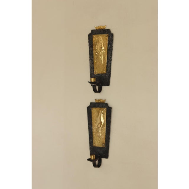 Made and Sourced from Sweden Pair Of Mid Century Brass and wrought iron sconces the hammered black metal paired with brass...