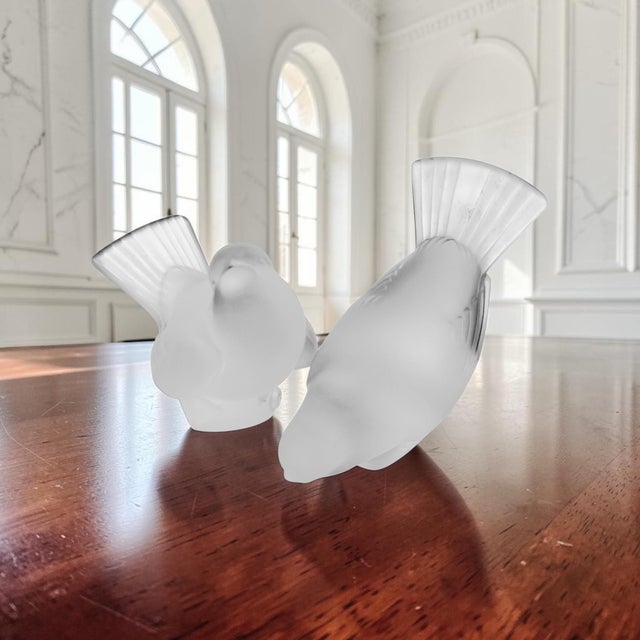 A matched pair of Lalique France Moineau crystal sparrow figurines comprising Moineau Hardi (Bold Sparrow) and Moineau...