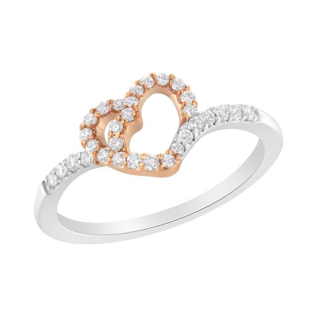 Make a statement with this dazzling two toned heart ring. Elegant and timeless, this cocktail ring features flared, flat...