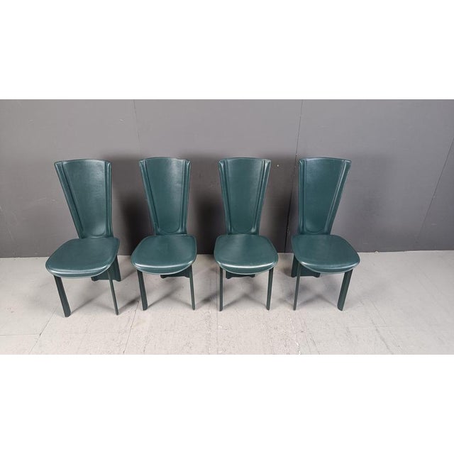 Set of 4 italian dining chairs with green reeded leather upholstery. Beautiful design 1980s - Italy Very good condition...