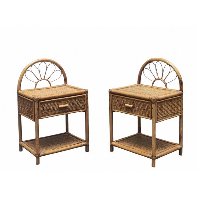 Beautiful pair of 1960s bedside tables made of natural rattan. The upper arch features a soft curve in Vienna straw, a...