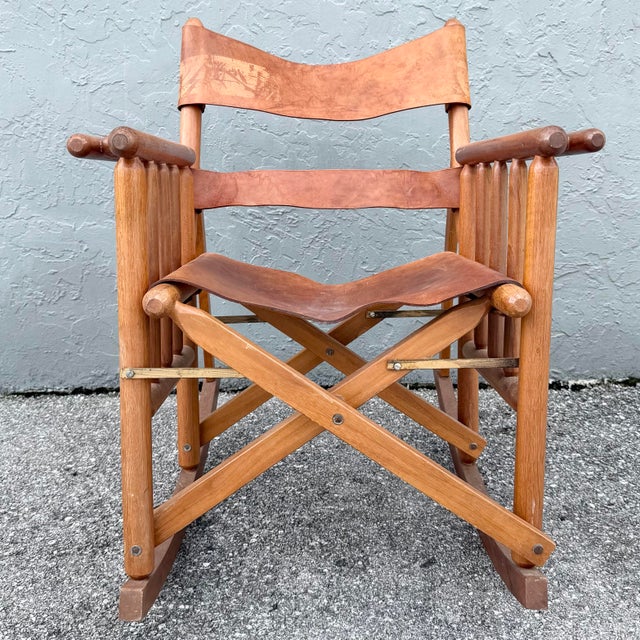 A distinctive vintage folding rocking chair handcrafted in Costa Rica, combining a warm solid wood frame with beautifully...