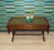 A classic piece of English-style furniture, referred to as a "harp table" (due to its lyre-shaped sides). Elegant,...