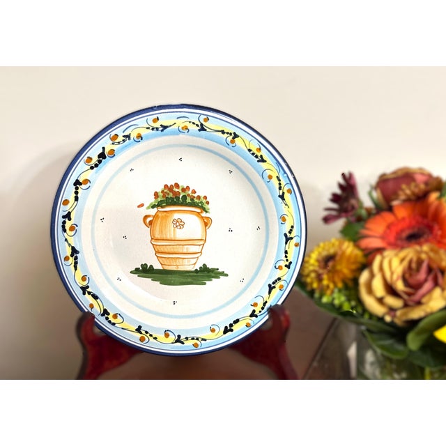 Charming Atelier Bondil French faïence wall plate from Moustiers-Sainte-Marie, Provence, featuring a hand-painted terra-...