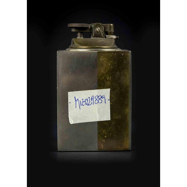 Vintage metal and brass lighter is an original decorative object realized in the mid-20th Century. Made in Italy....