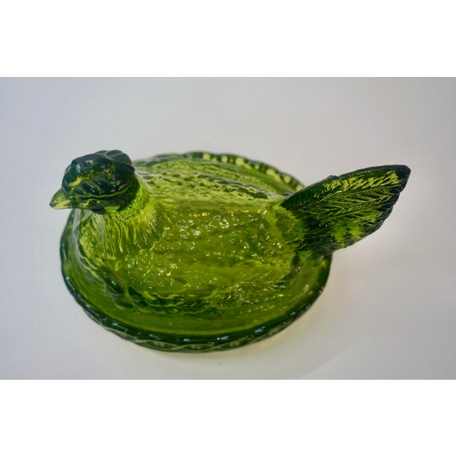 Add a touch of farmhouse chic or Mid-Century charm to your decor with this striking Hen on Nest covered dish. Rendered in...