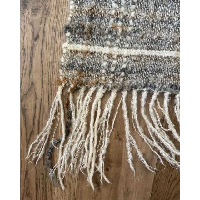 A rare, signed studio weaving by New England fiber artist Sara Wright, known for her richly textured handwoven textiles...