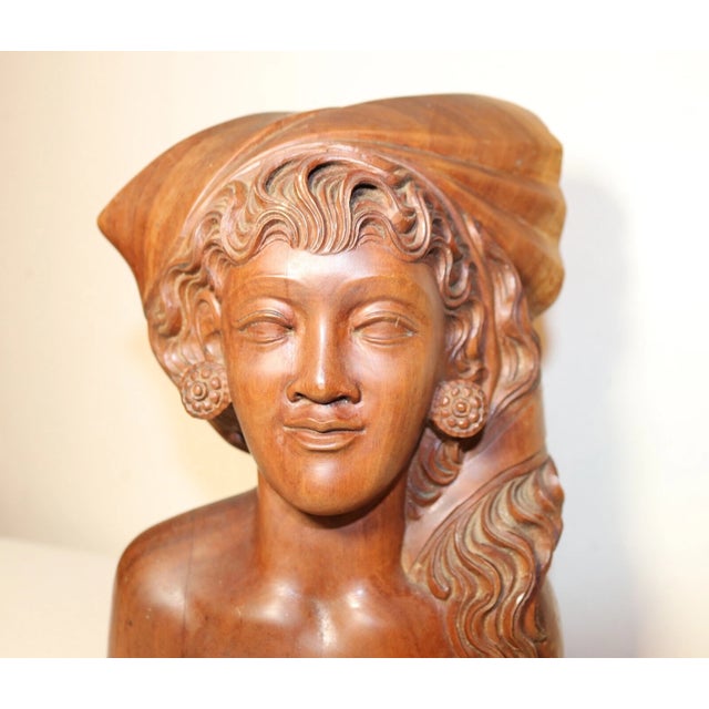Up for sale is a wonderful antique hand carved wooden Balinese bust sculpture. It's carved by hand out of a very dense,...