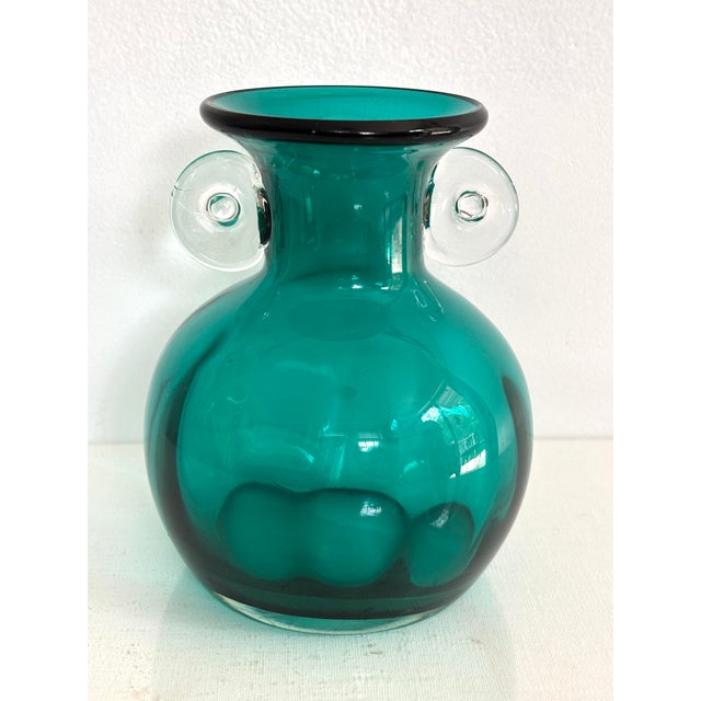 Pretty emerald green glass Art Deco vase. Most items found at Pub & Oasis are vintage and antique in nature which we...